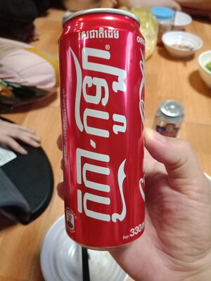 Cola with sugar and artificial sweetener